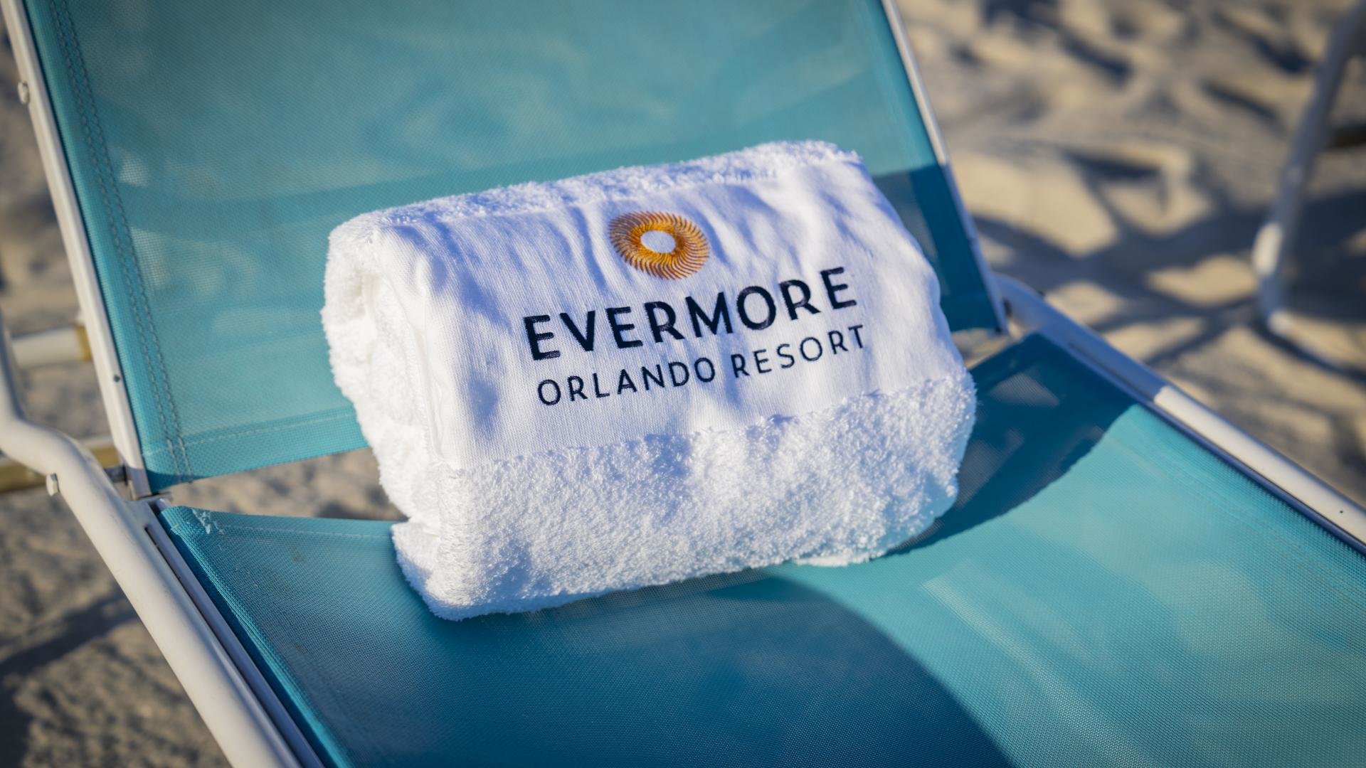 evermore branded towel on a lounge chair